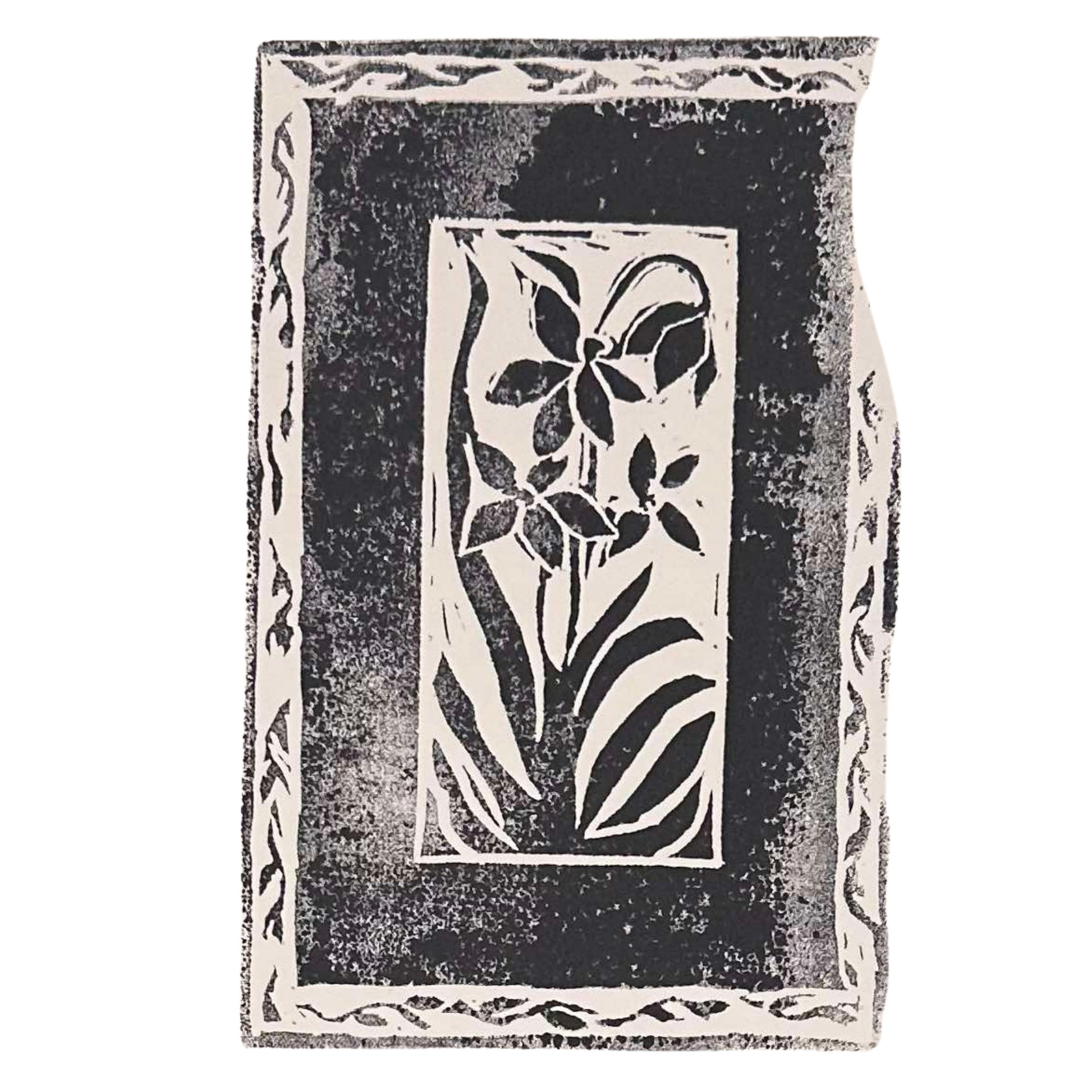 Framed Florals Handmade Stamp Art by Rustic County: This artisan-crafted black and white print features a tall floral design complete with leaves and flowers. The piece is surrounded by a decorative border, offering a textured, rustic appeal that enhances its personalized artistic charm.