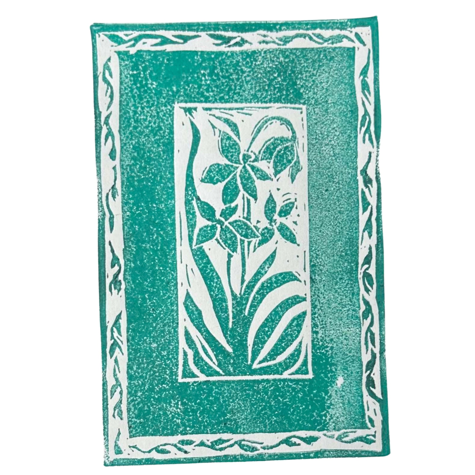 Introducing the "Framed Florals Handmade Stamp Art" by Rustic County, a stunning green and white linocut print showcasing a stylized floral design. This handcrafted art piece features a textured appearance with flowers and leaves at its heart, encircled by a border of leaf-like patterns.