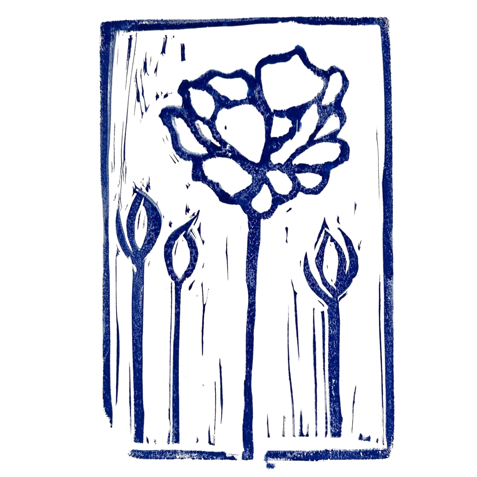 The "Inked Petals Handmade Stamp Art" by Rustic County showcases a bold blue linocut print of a large flower with inked petals, a tall stem, and three smaller buds on a white background, all exhibiting a handmade, textured appearance.